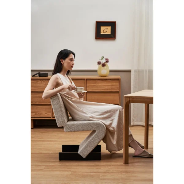 Z-Form Upholstered Cantilever Chair in Cream Bouclé — in a room setting