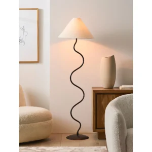 Zigzag Wavy Iron Floor Lamp with Conical Linen Shade in black — in a room setting