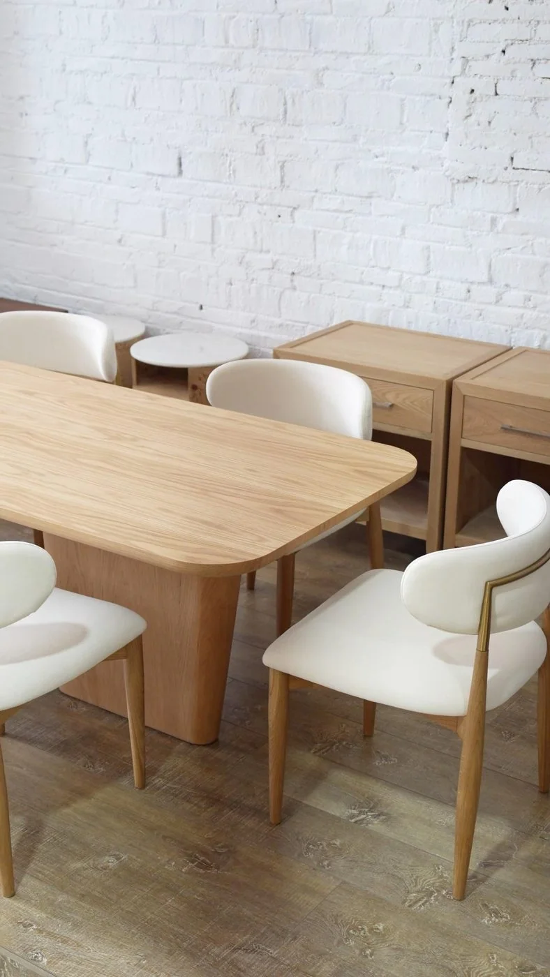 Light oak dining table with upholstered dining chairs