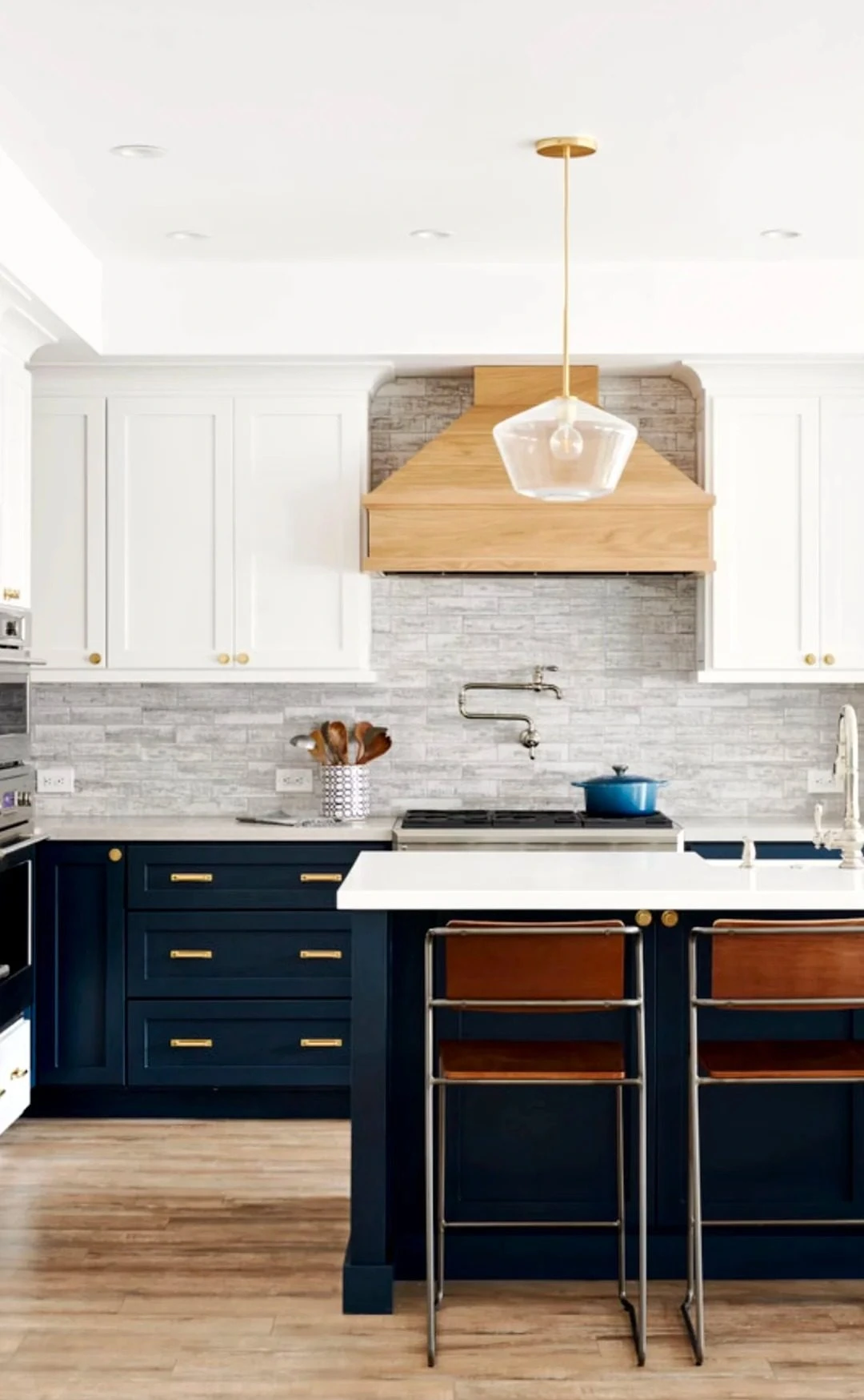 Finished blue and white kitchen cabinetry with island