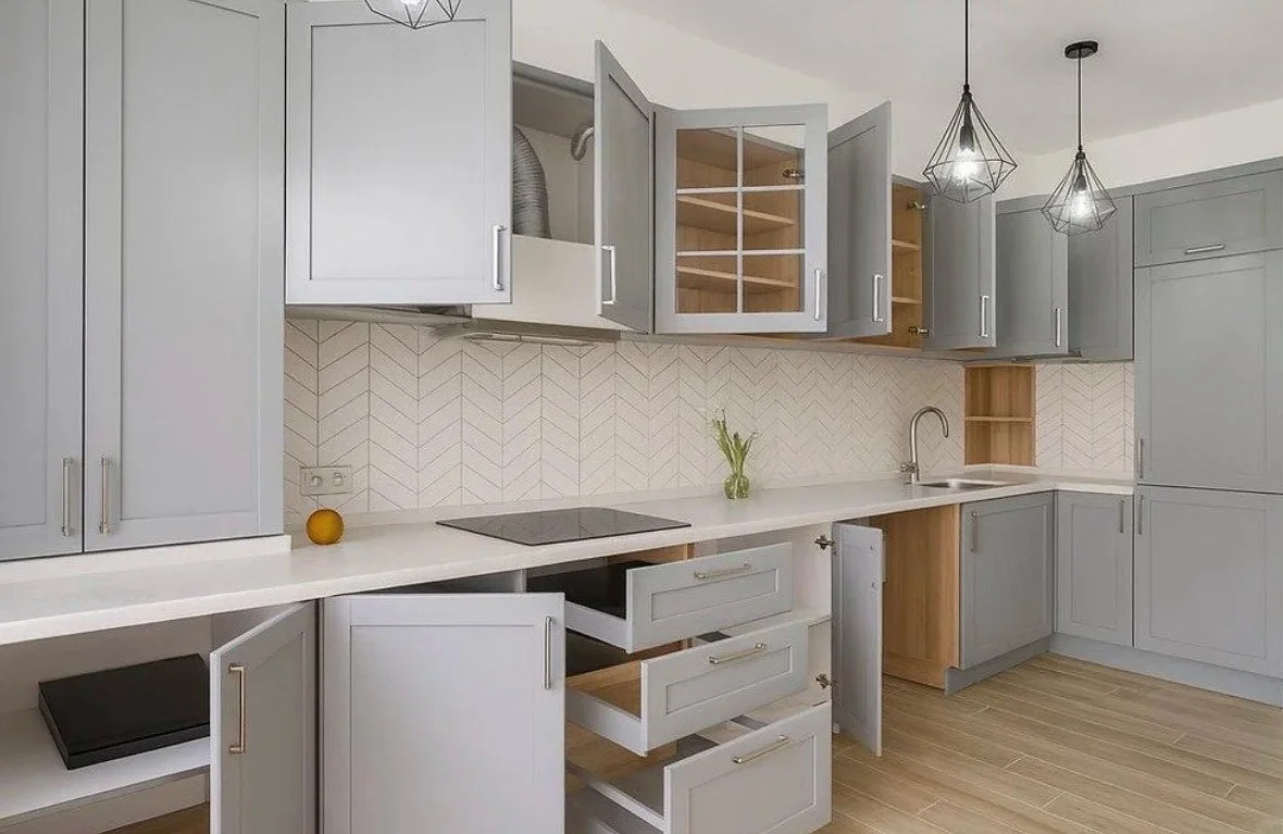 Painted custom kitchen cabinetry with smooth panel doors
