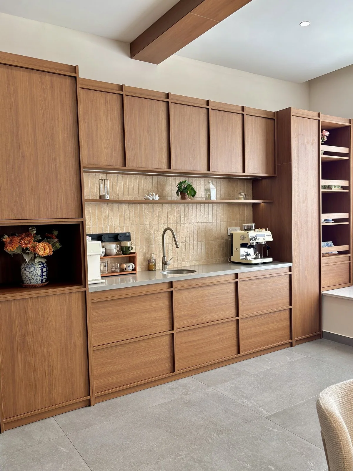 Whole-home custom cabinetry with continuous warm wood surface finish