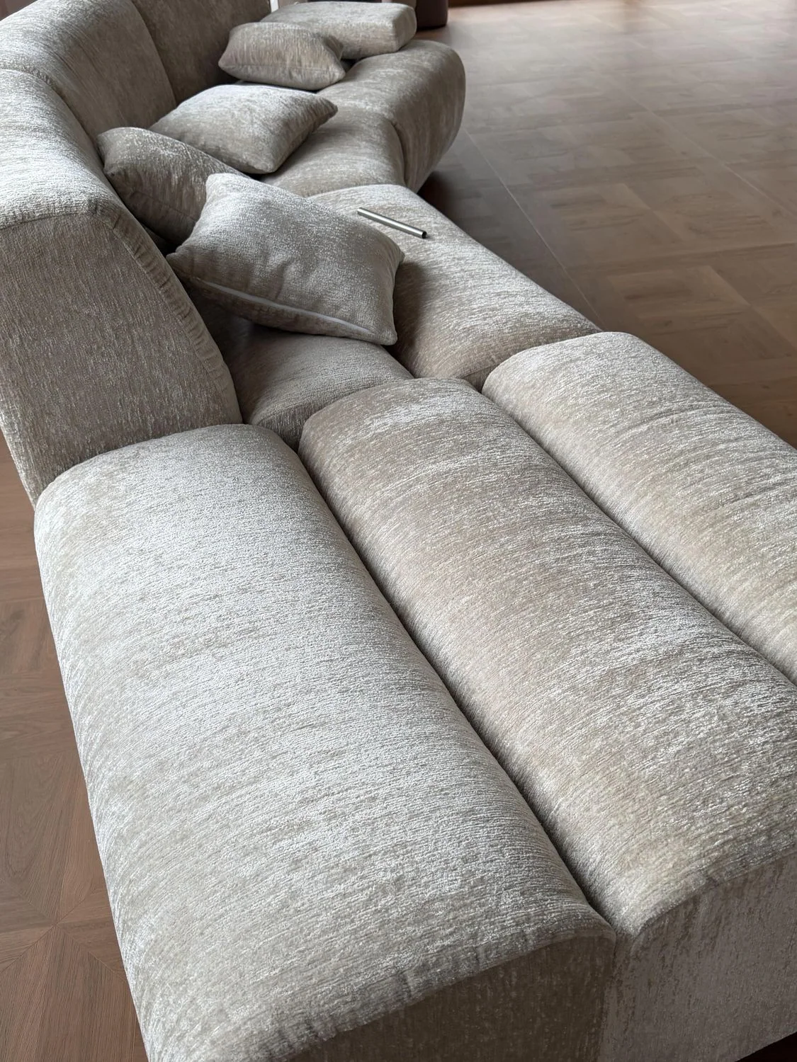 Close-up of a soft neutral chenille sofa seat