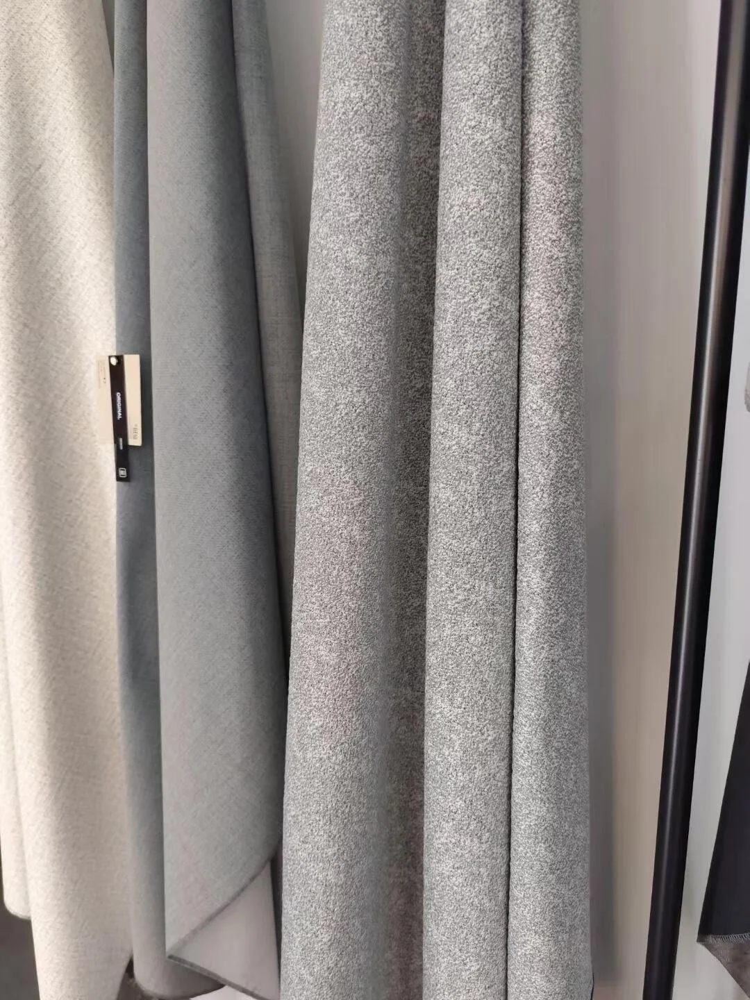 Neutral technical upholstery fabric hanging in soft folds