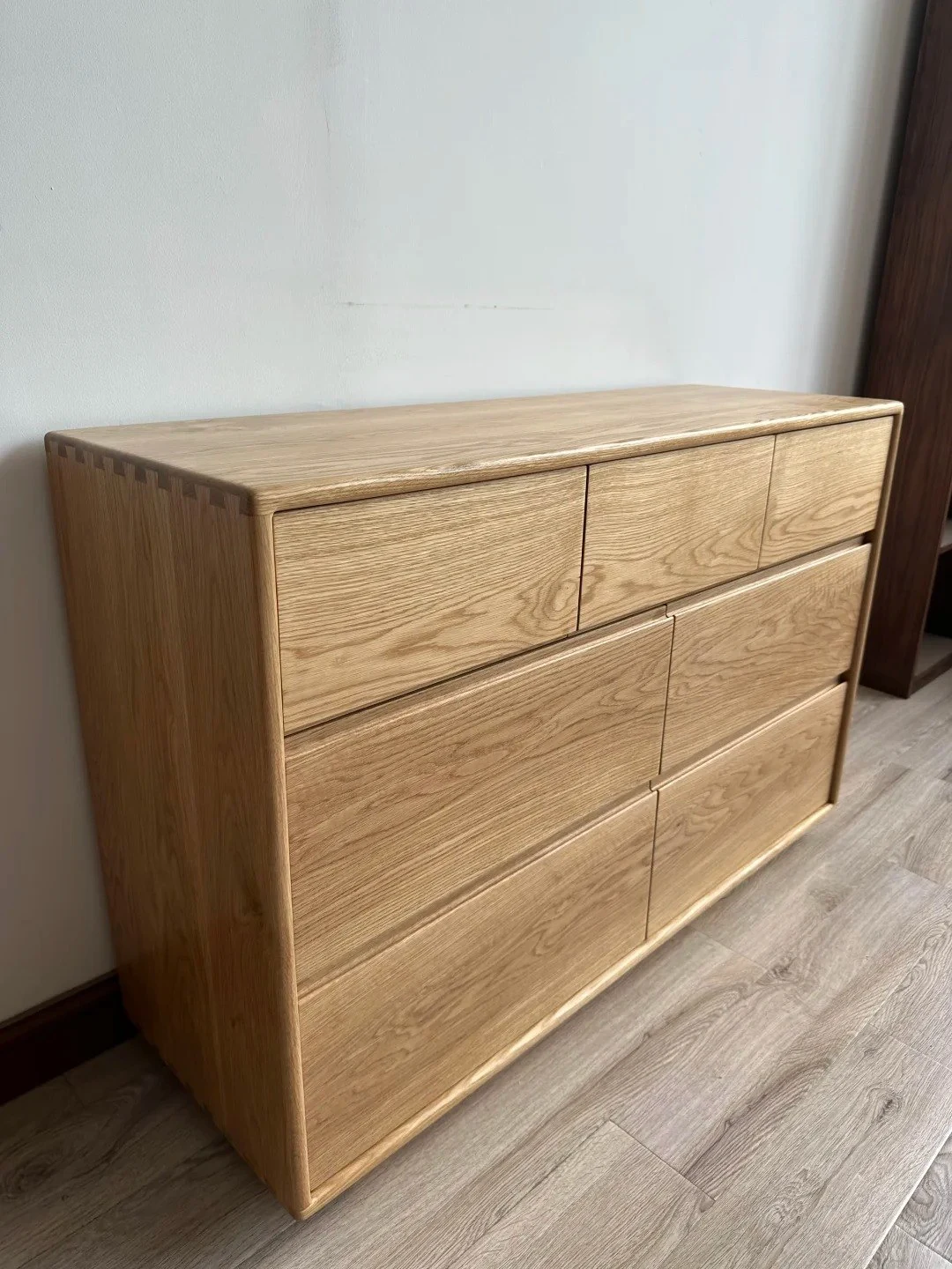 Finished white-oak dresser with visible case proportions