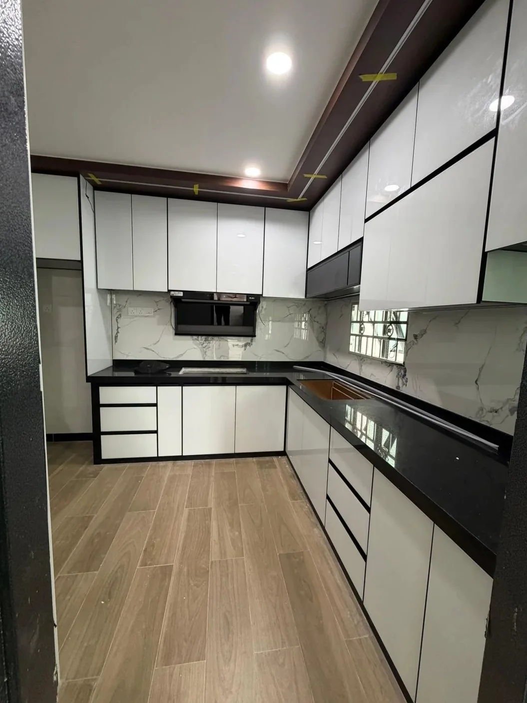 Aluminum-framed cabinetry can create a slim, graphic outline around panels and doors.
