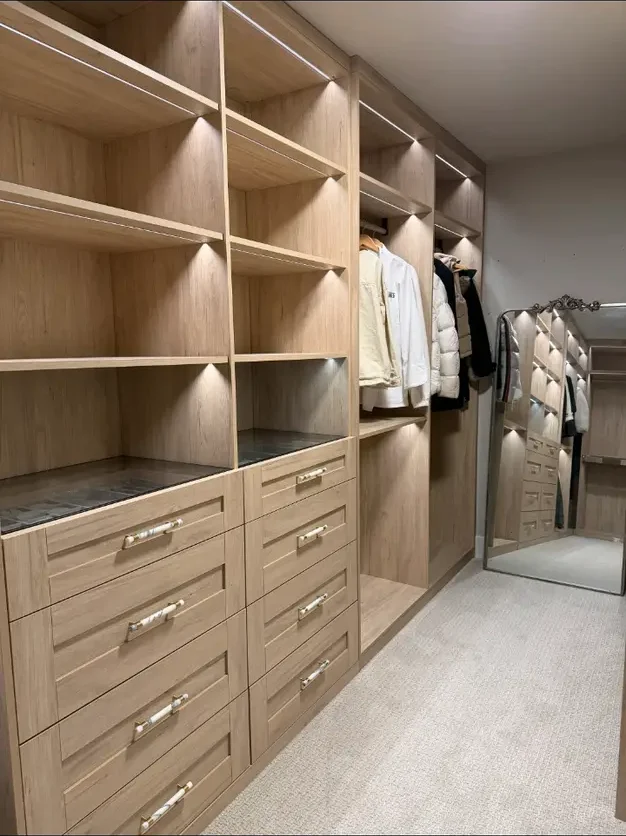 Completed warm oak walk-in closet in Seattle