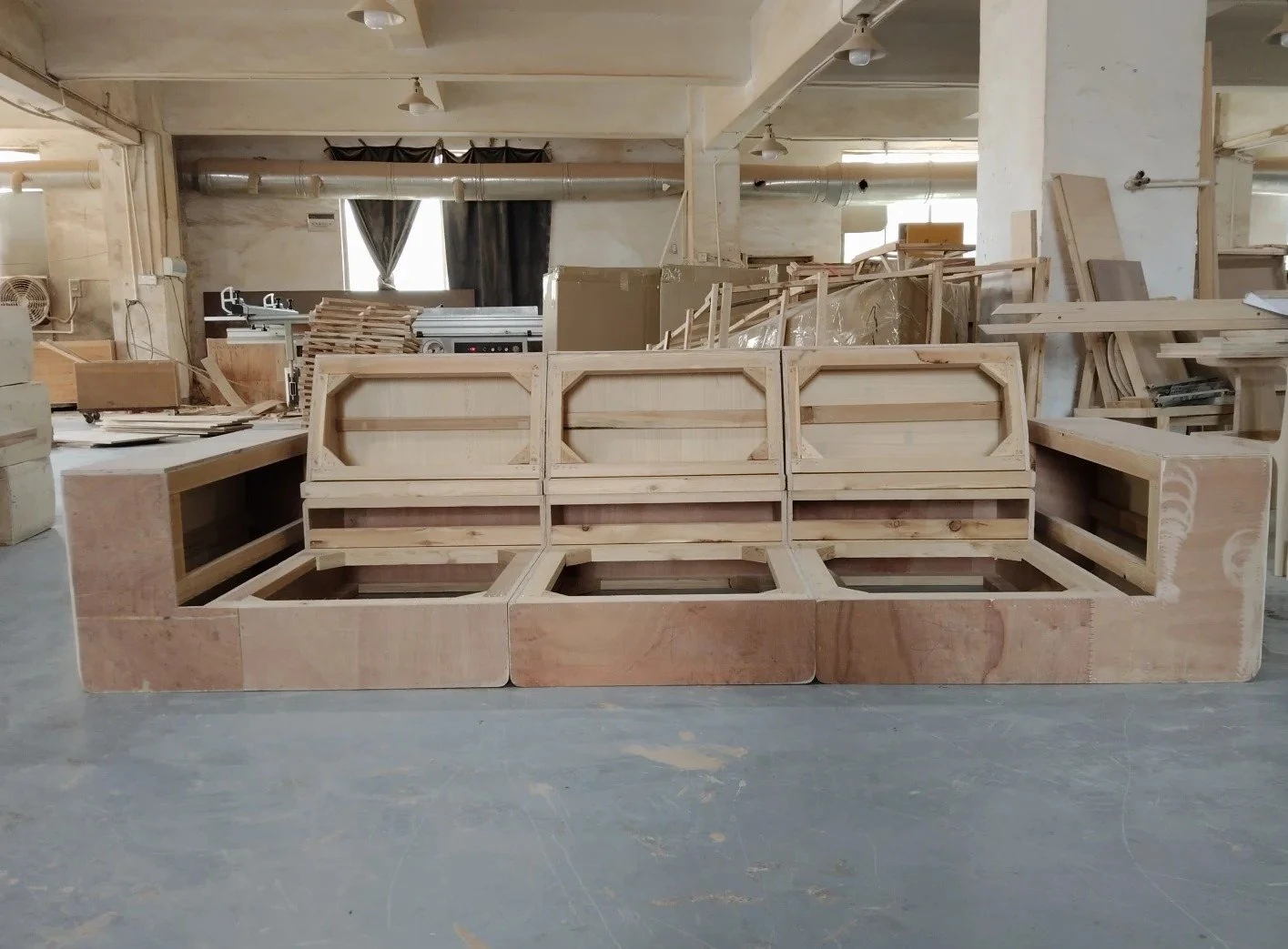 Exposed sofa back frame in a furniture workshop