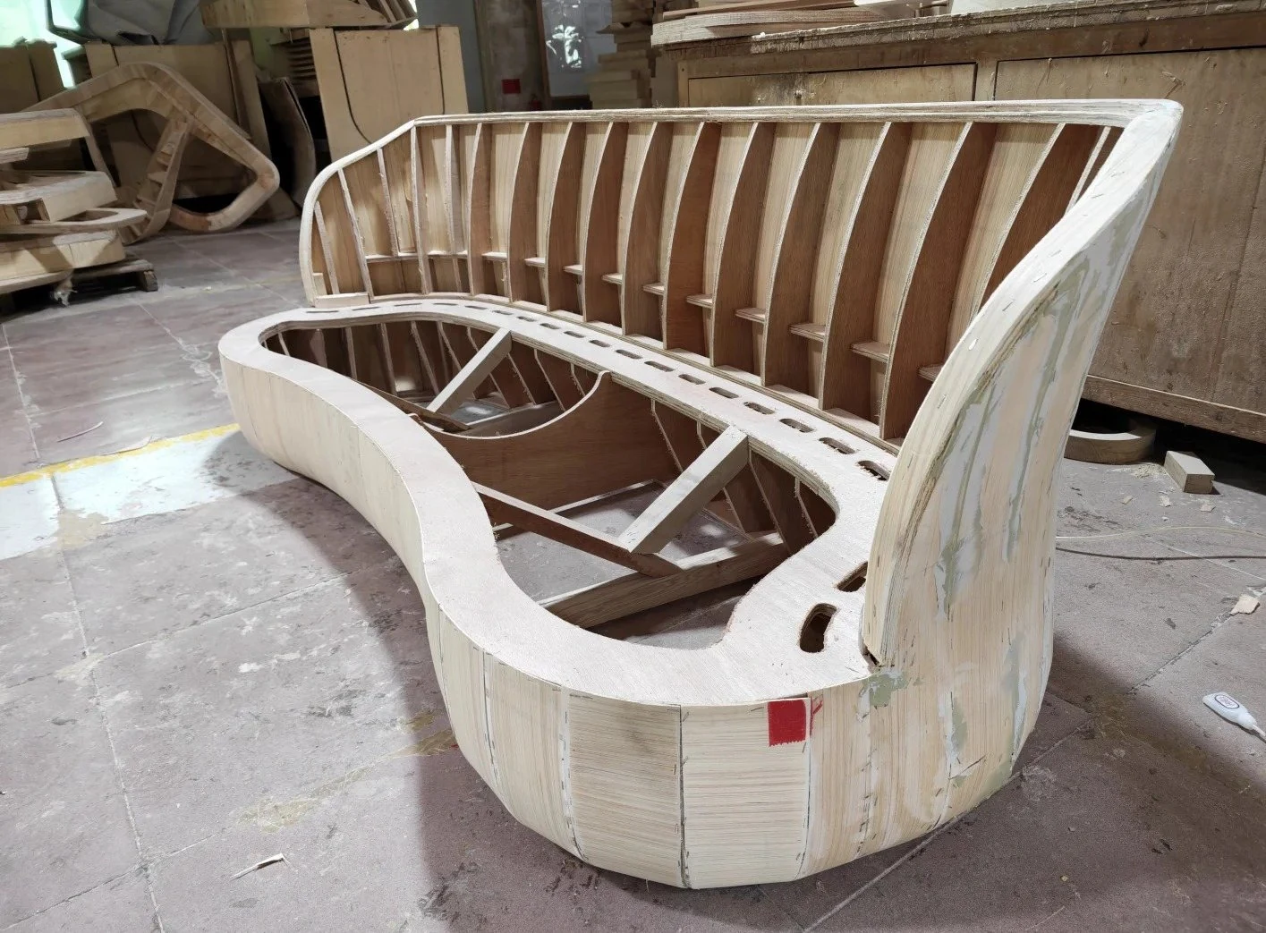 Curved timber sofa frame with shaped ribs