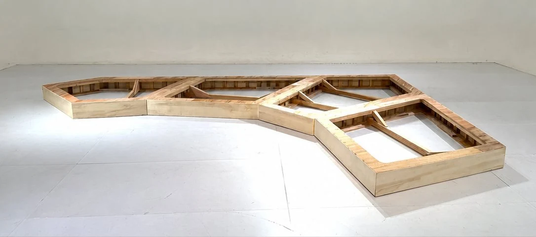 Curved sofa frame before cushioning