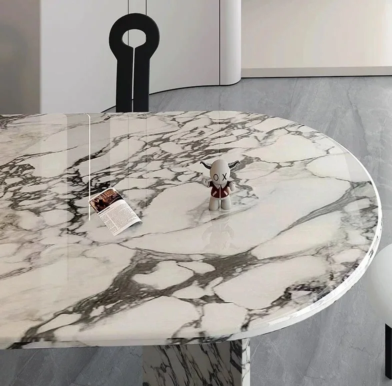 Close-up of polished marble dining tabletop and rounded edge