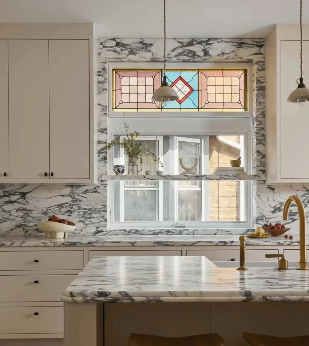 White marble kitchen surfaces showing high-contact stone areas that require careful cleaning