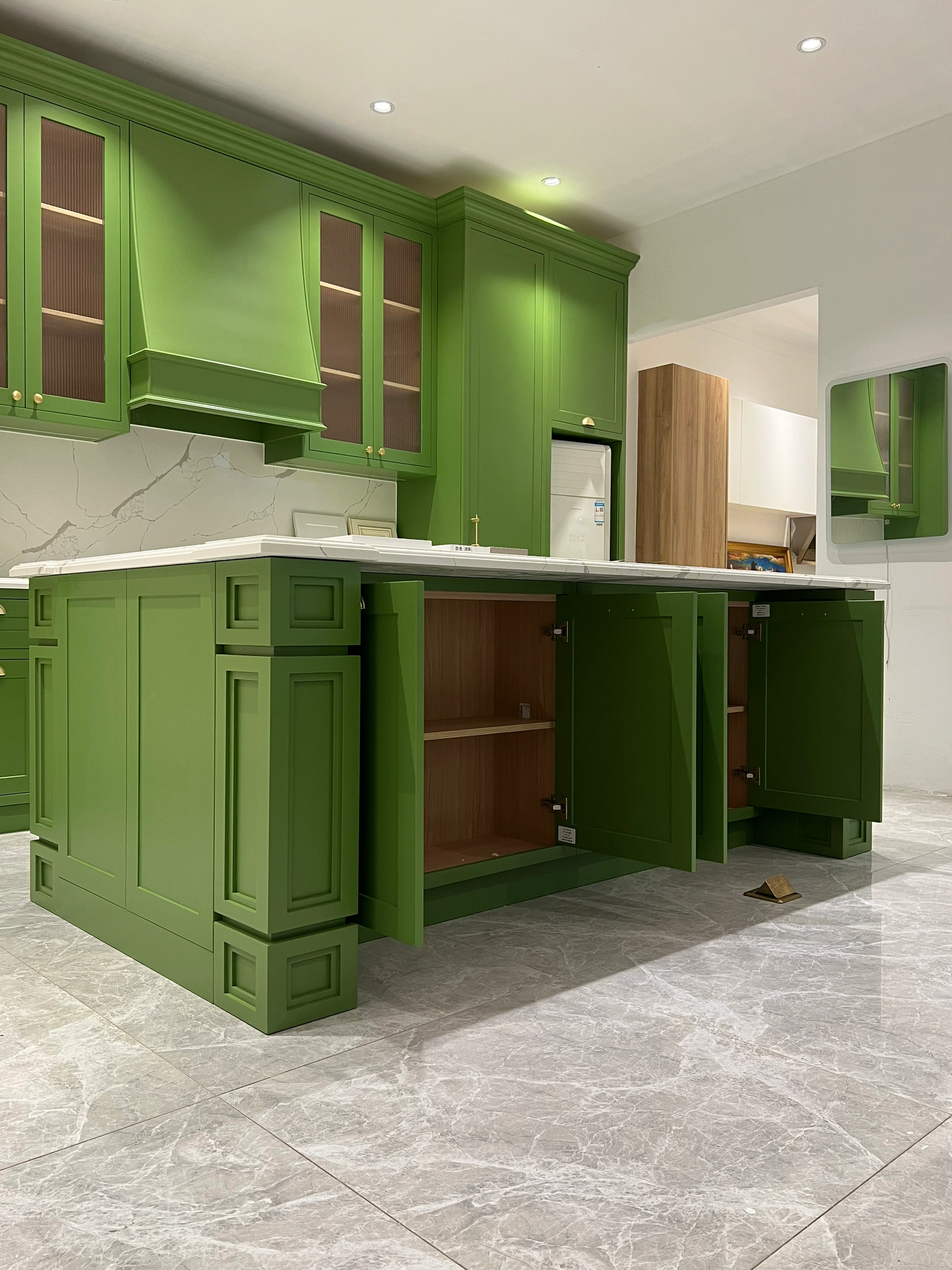 A wider trial-assembly view helps reveal relationships between base cabinets, fillers, doors and adjacent modules.