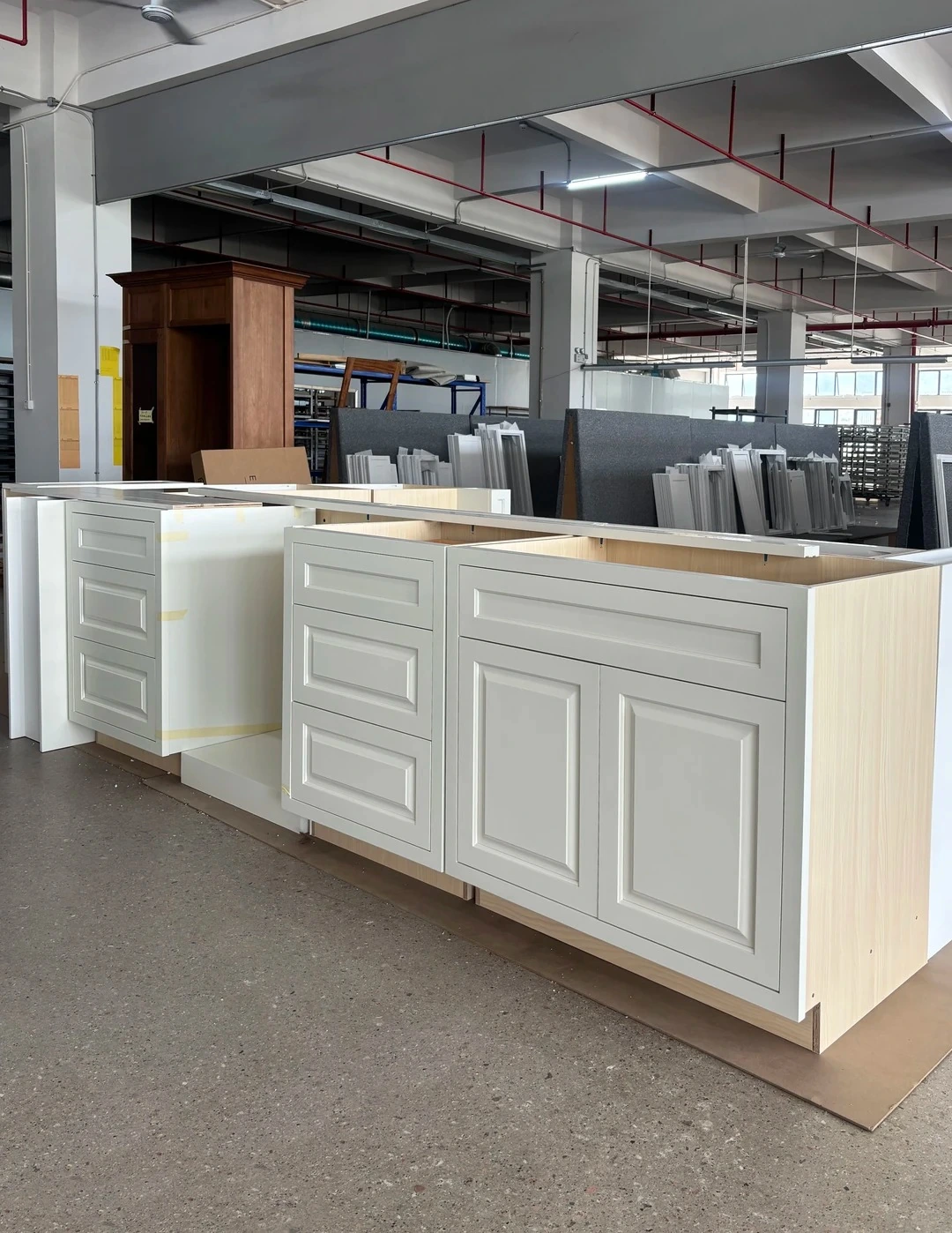 A broader factory setup can reveal cumulative alignment issues that are difficult to see on a single cabinet.