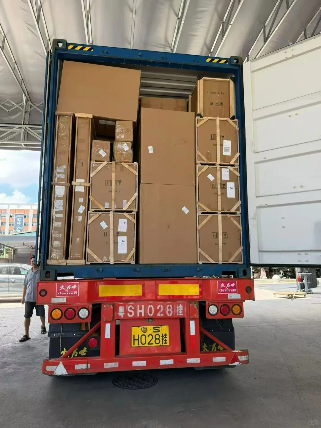Before loading, confirm package labels and the packing list against the shipment plan.