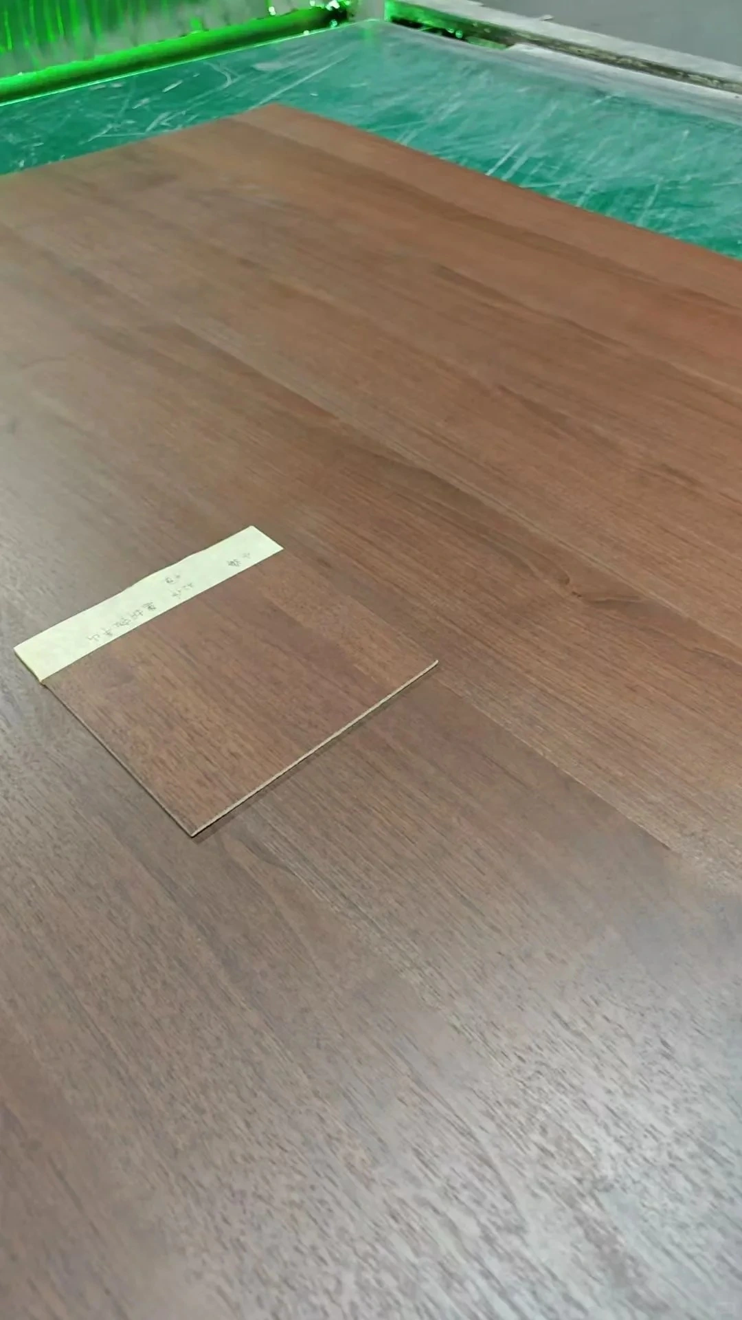 Veneer leaves taped and positioned before pressing