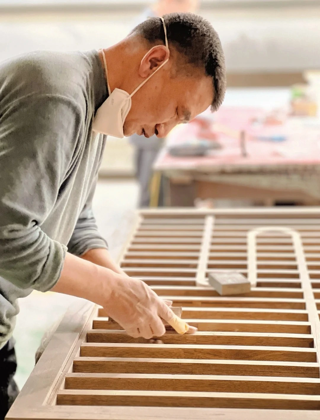 Craftsperson checking a furniture component
