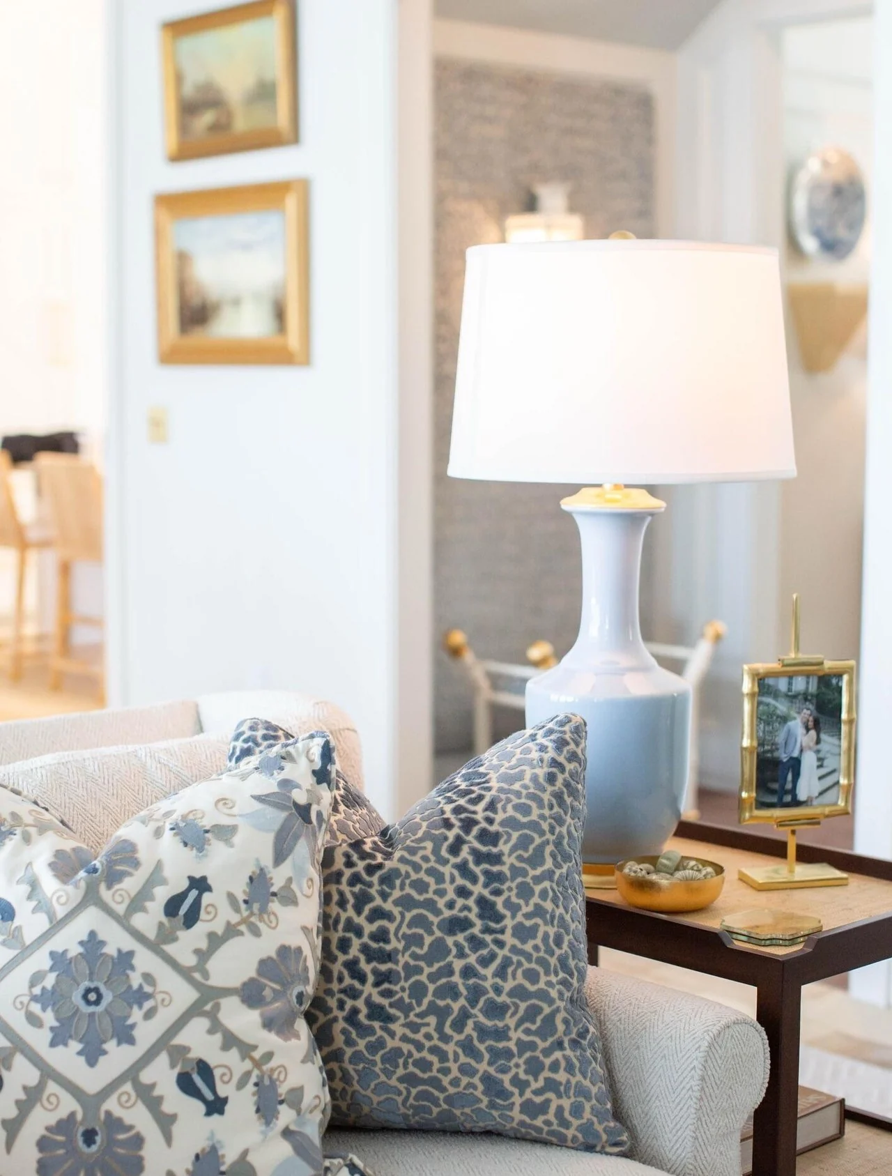 Blue patterned pillows in a coastal living room