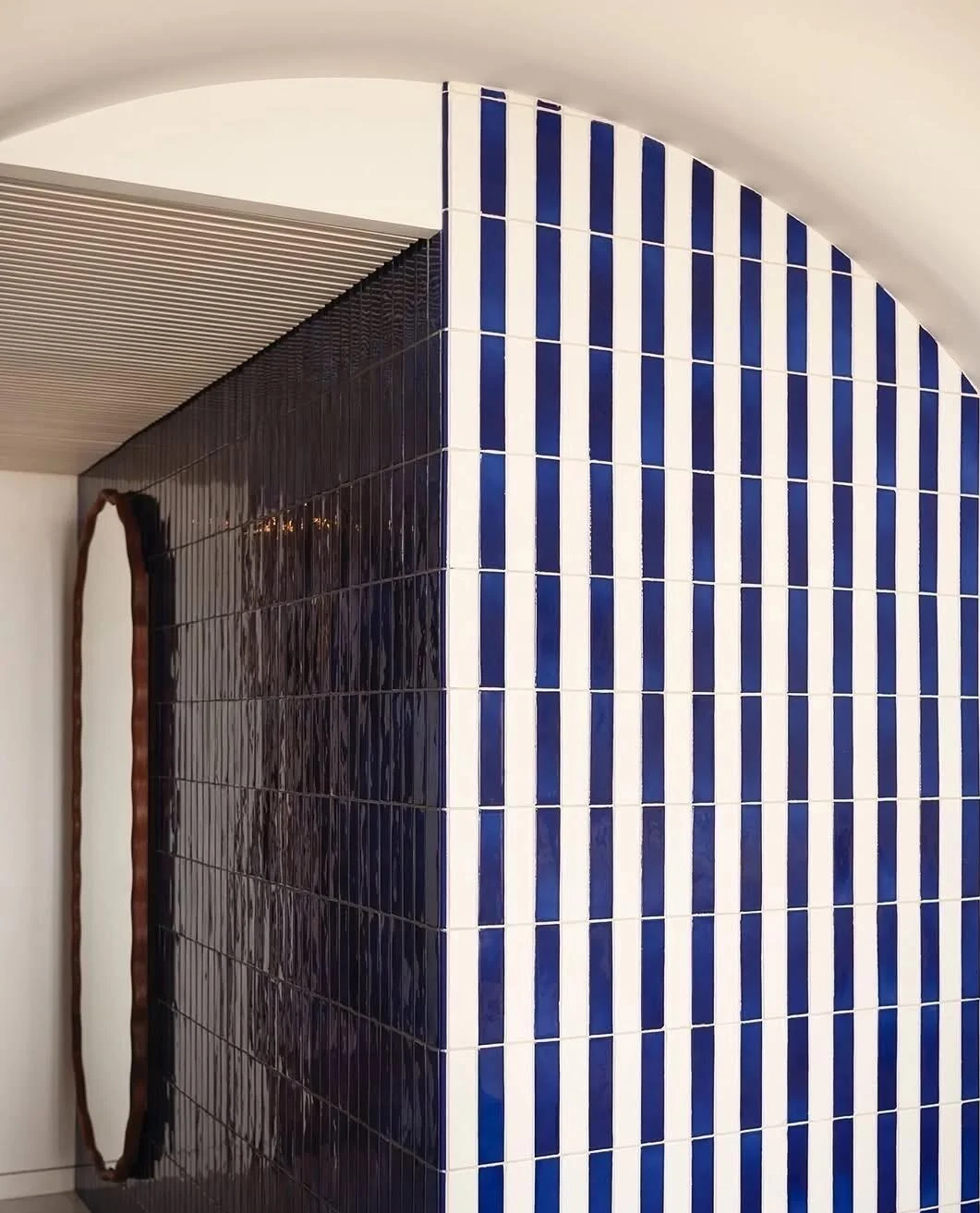 Blue-and-white vertical tile detail in a coastal home
