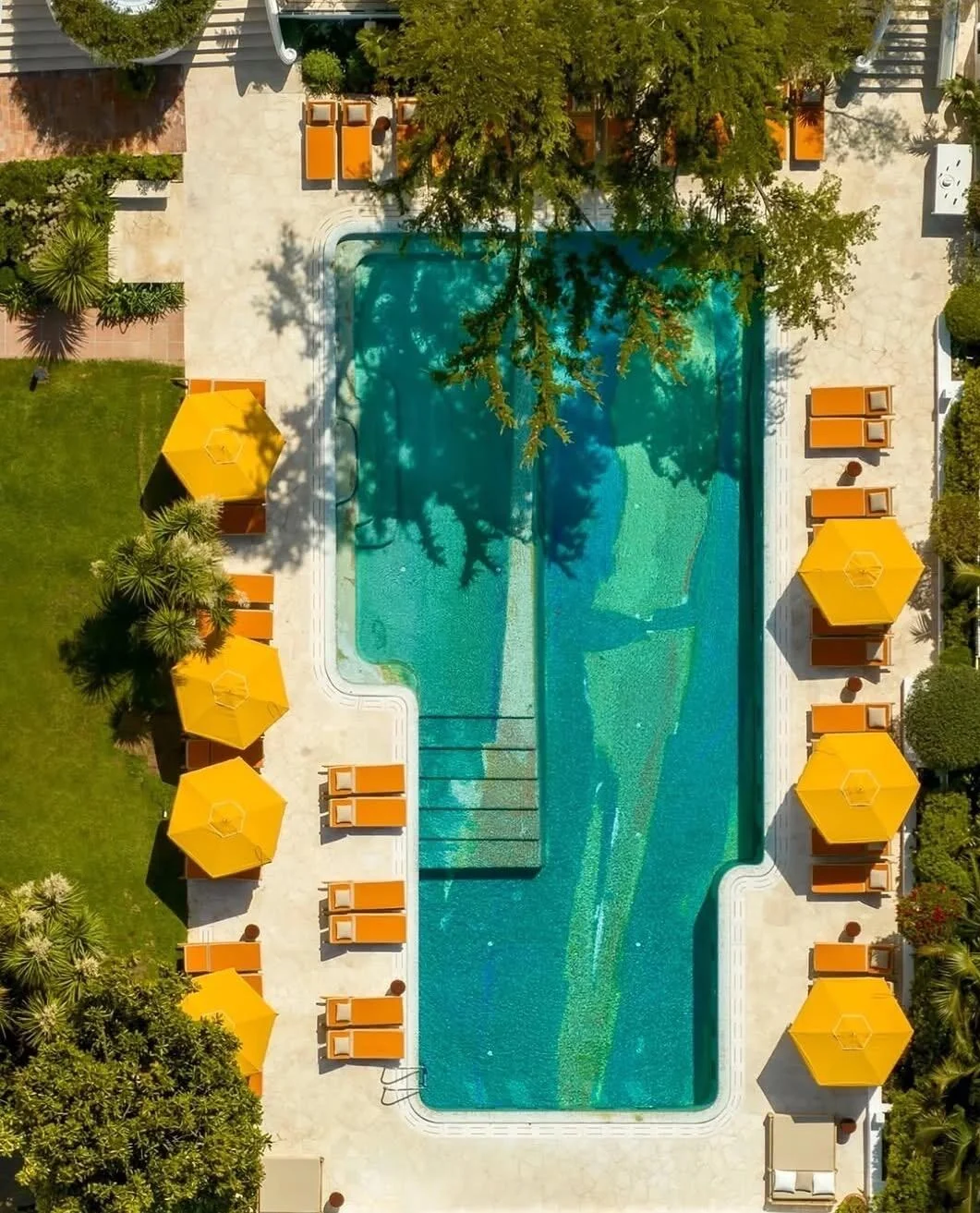 Poolside coastal area with bright umbrellas