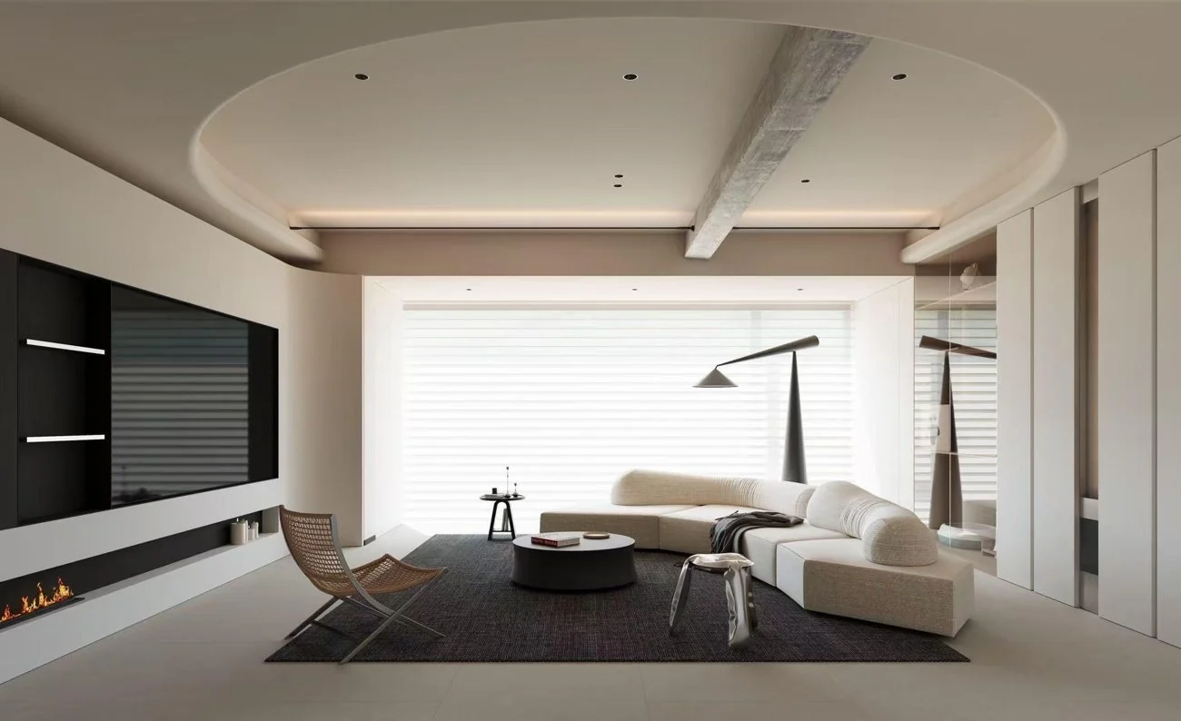 Sculptural ceiling geometry and dark accents create a quiet focal point.