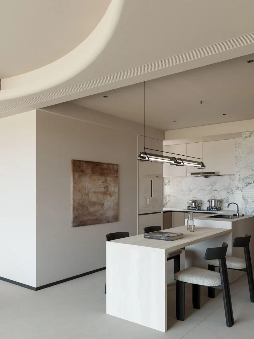 Stone, dark fittings and matte cabinetry establish material contrast.