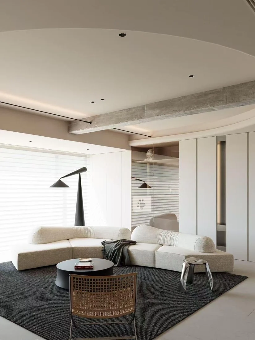 Low seating and a bold dark floor plane make the room cohesive.