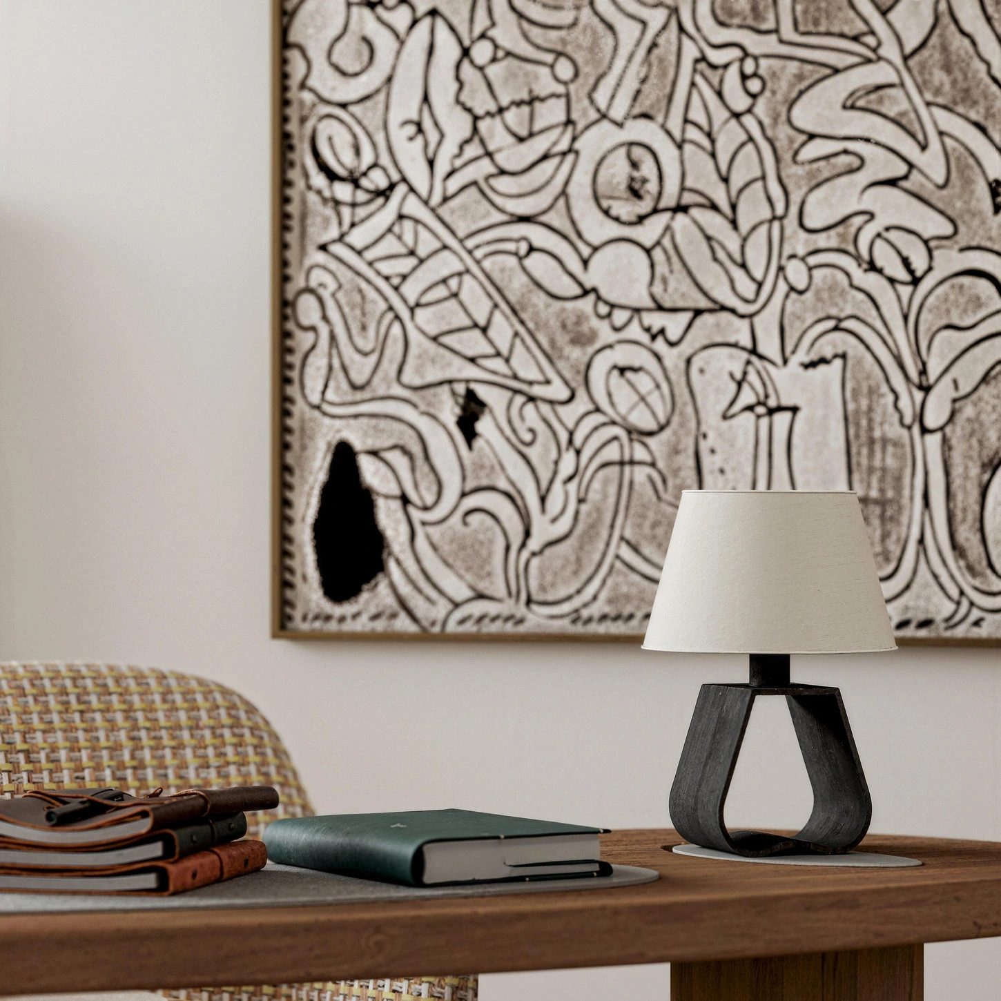Close-up of wood furniture, sculptural lamp and textured artwork in a Japandi room