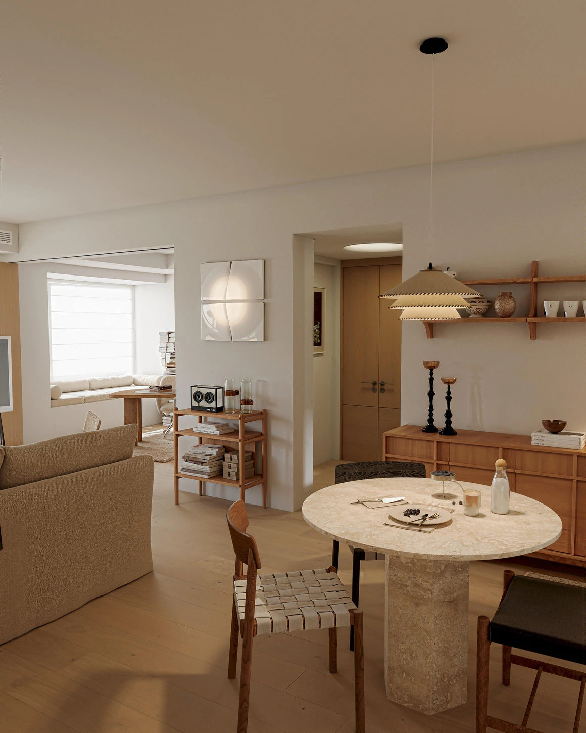 Japandi open plan dining room with light wood furniture and pale stone table